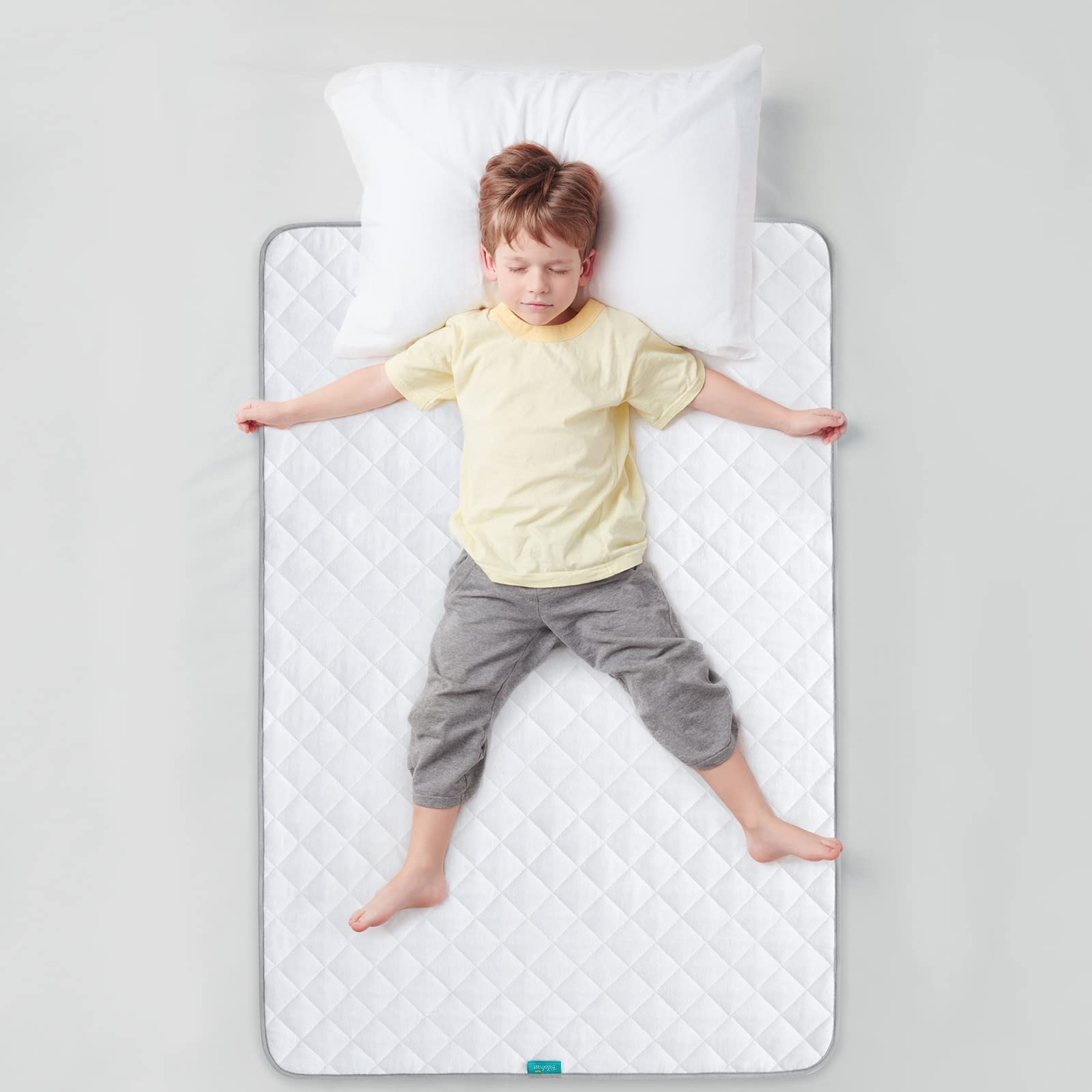 Biloban bed pad used in a home setting for pets or kids