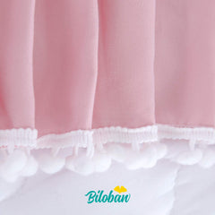 Biloban pink crib skirt side view shows soft fabric and neat drop