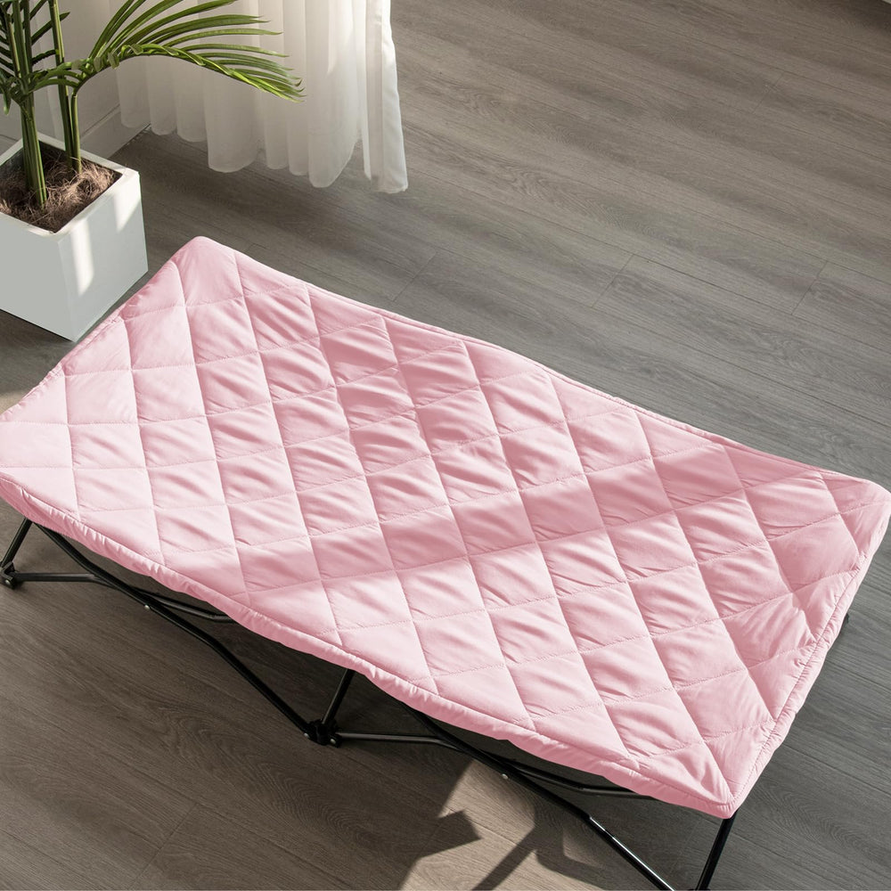 Bright pink Biloban sheet on a bed setup adds cheerful travel style.