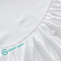 Biloban satin crib sheets on crib demonstration highlights cool, smooth surface ideal for sensitive skin.