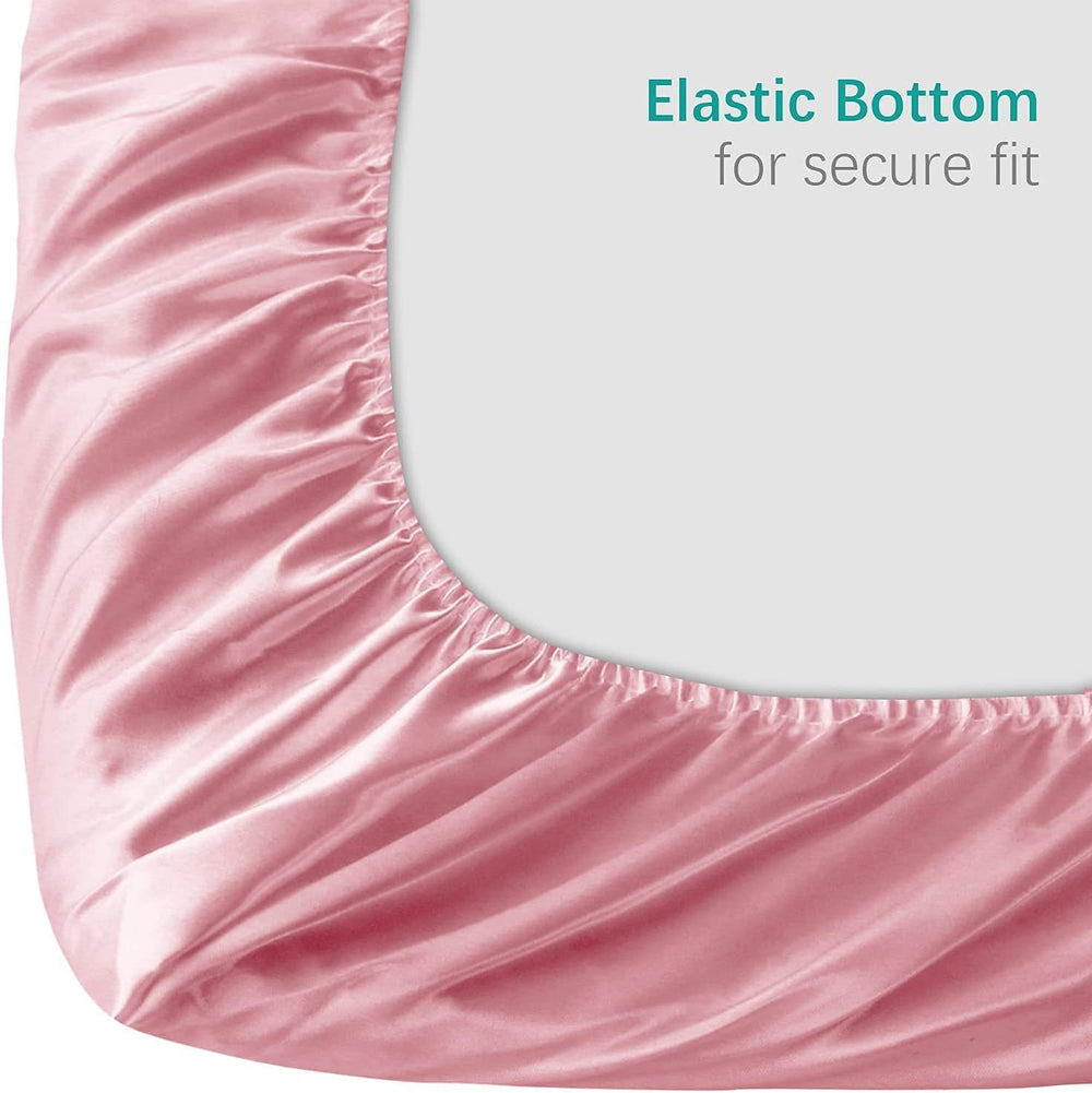 Biloban satin mini crib sheets cooling fabric closeup highlights smooth texture.