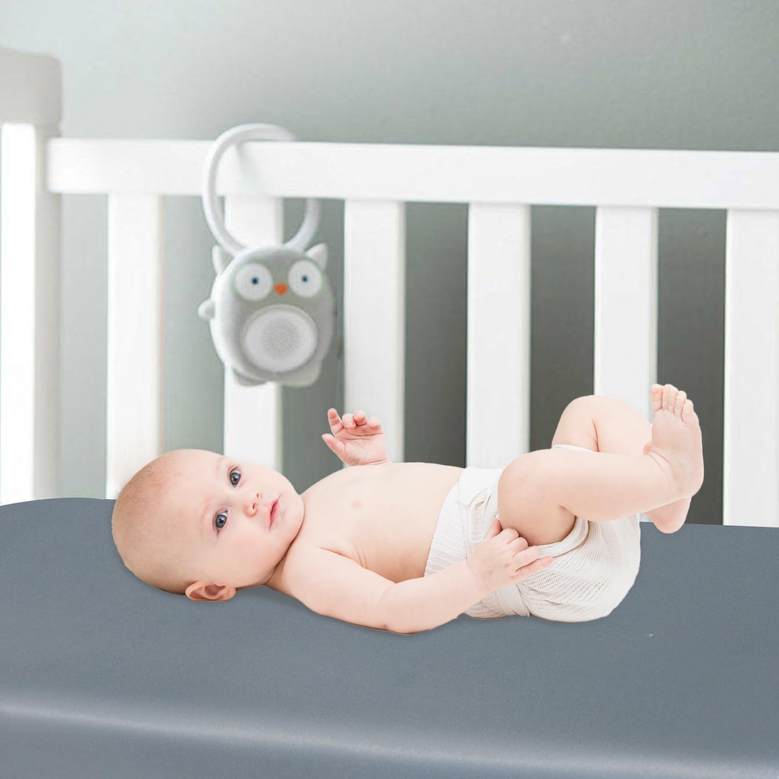 Biloban satin mini crib sheets two-pack grey pink on display.