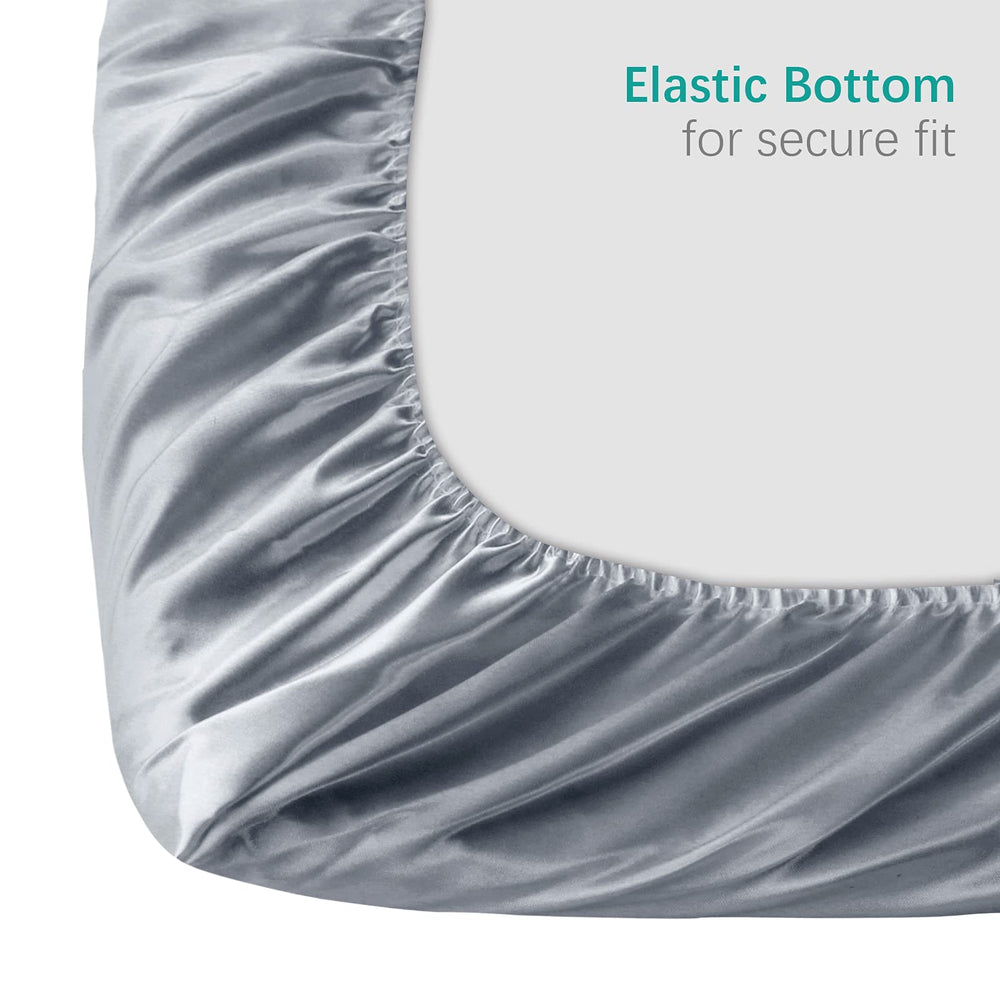 Close-up of Biloban satin fabric on pack-n-play sheet showing smooth texture.