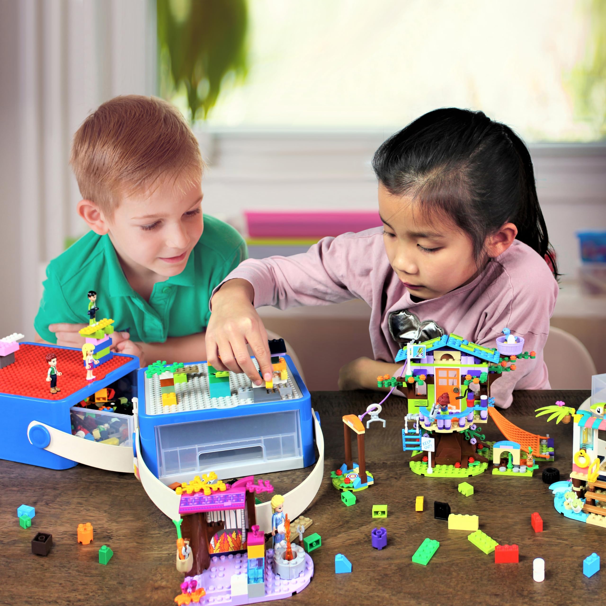 Bins & Things kids-cleanup-system image illustrates simplified cleanup after playtime.