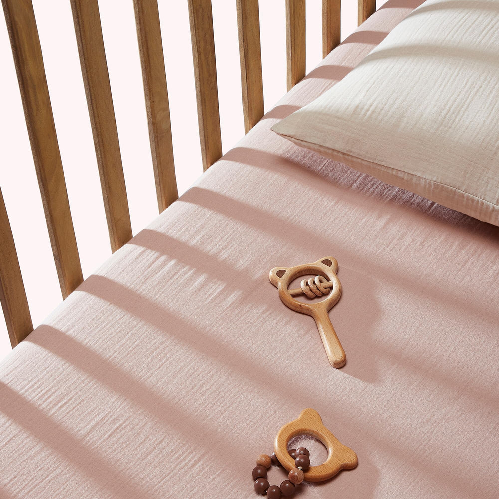 BIOWEAVES universal-fit oval bassinet edge showing secure elastic