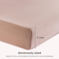 BIOWEAVES dusty pink bassinet sheet on mattress highlighting color and fit