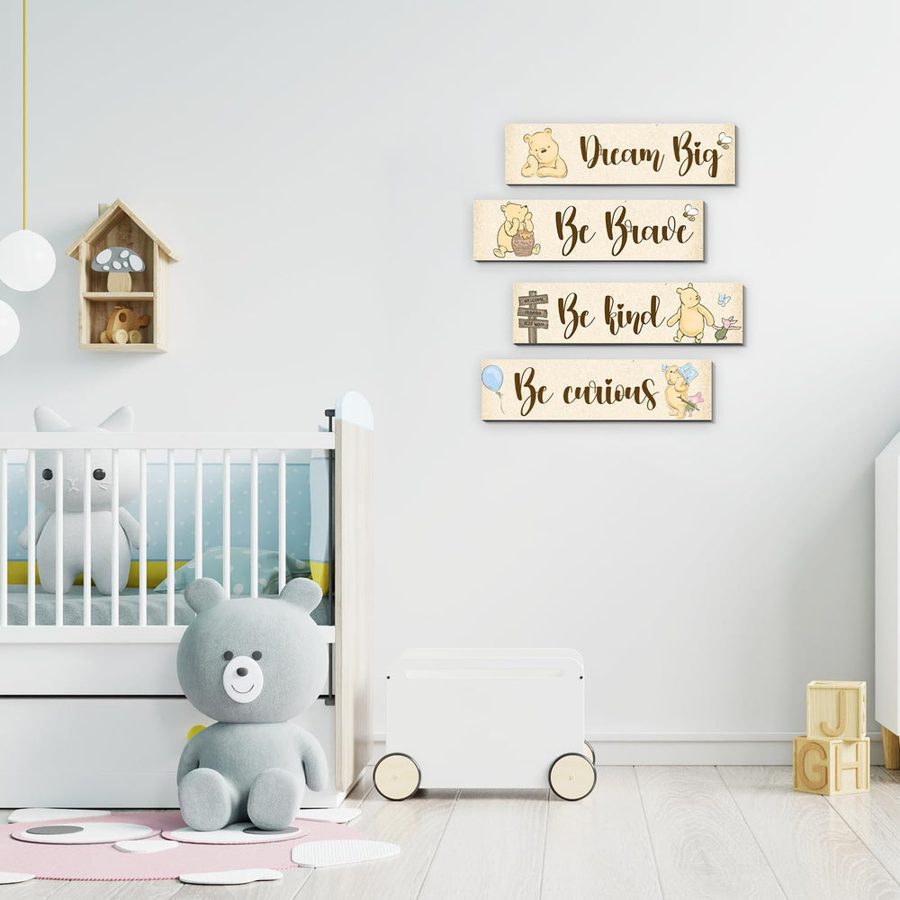 BirtDerr Pooh-themed wall decor adds charm to a baby room.