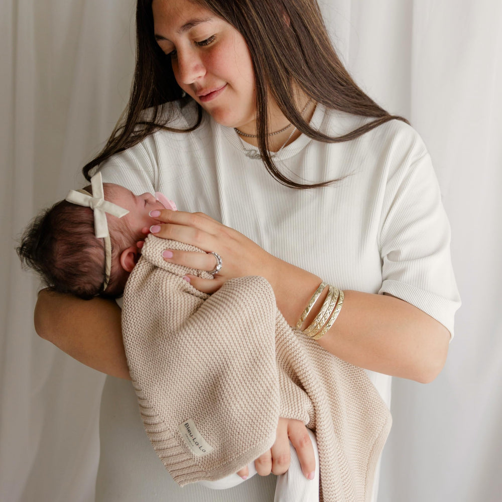 Bleu La La Heritage Knit Blanket's breathable organic cotton keeps little ones comfortable year-round.