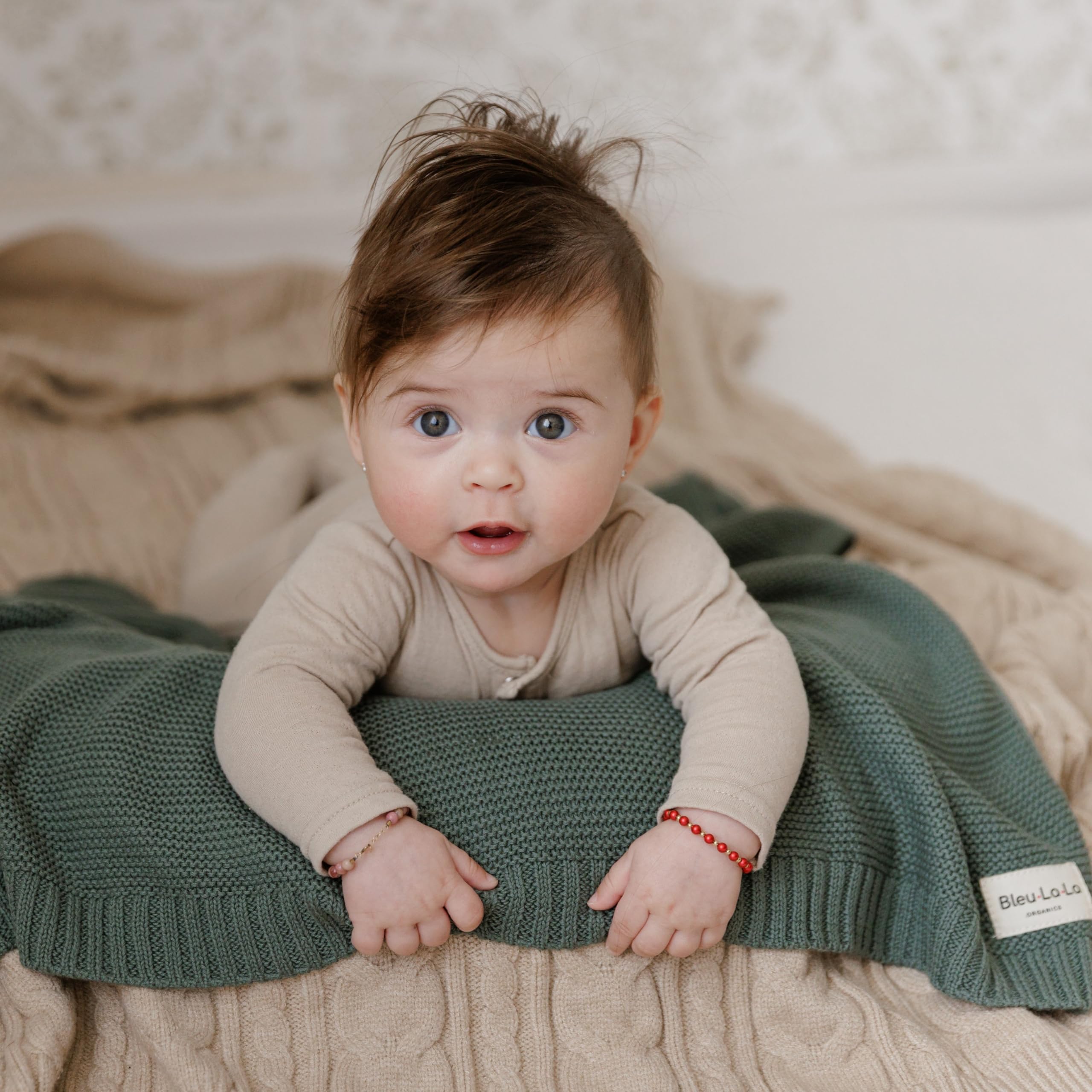 Bleu La La heritage-knit blanket in stroller scene shows easy travel-compatibility.