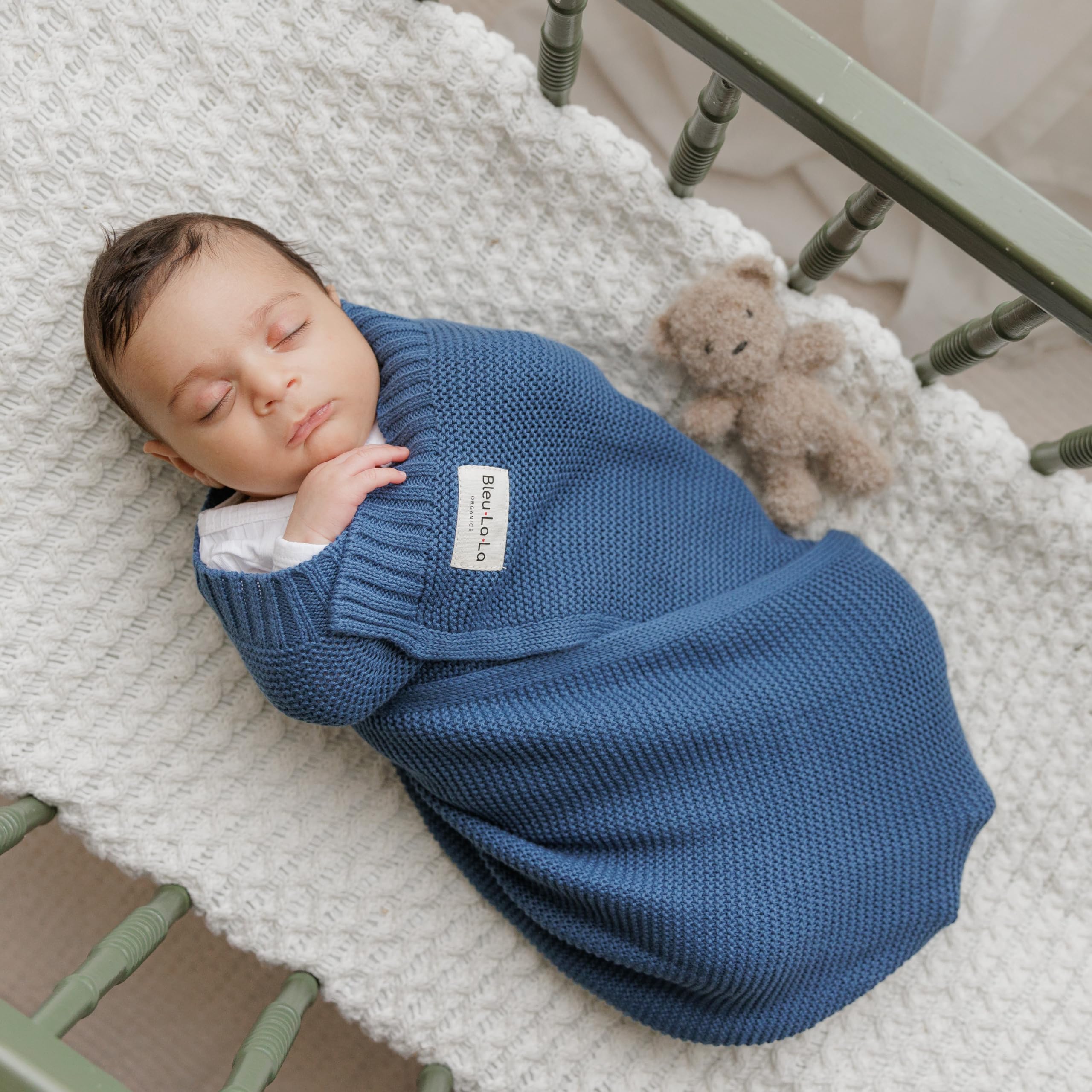 Bleu La La heritage knit swaddle denim blue in a nursery setting.