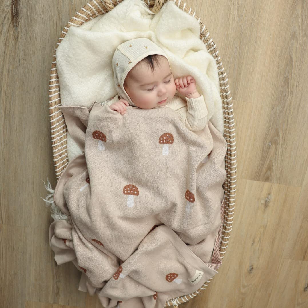 Bleu La La knit baby blanket mushroom mocha serves as nursery decor and cozy layer.