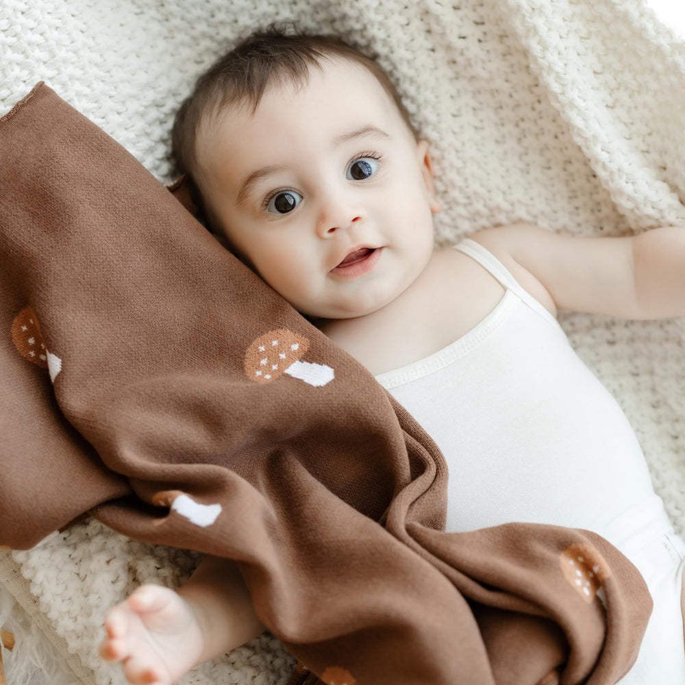 Bleu La La knit blanket mushroom mocha fits stroller and car seat for travel.