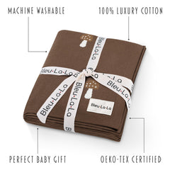 Bleu La La knit blanket mushroom mocha used as swaddle for newborn snugness.