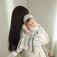 Bleu La La knit baby swaddle sheep grey nursery pattern supports cozy swaddling