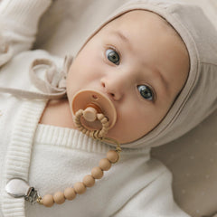 Bleu La La Luladream pacifier cream handle provides chew-friendly comfort.