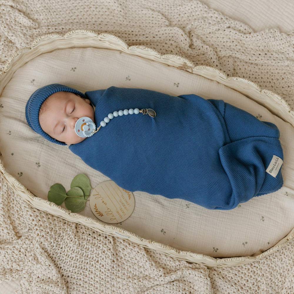 Bleu La La Luxe hat in denim blue, snug fit for newborn warmth.