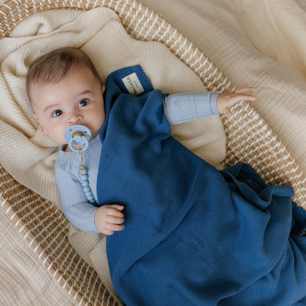Bleu La La Luxe swaddle in denim blue, ideal for swaddling and stroller outings.