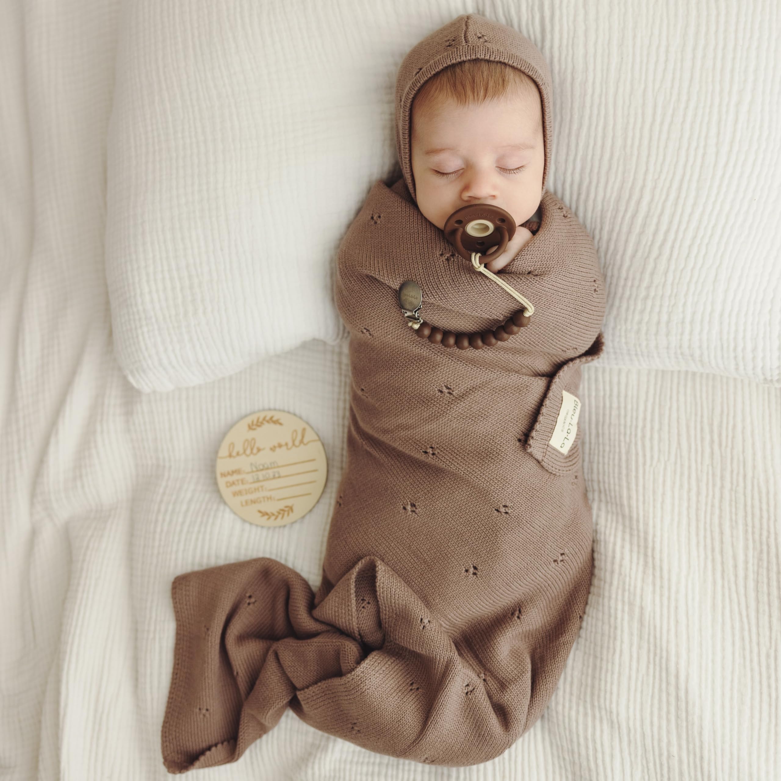 Bleu La La Pointelle Swaddle Mocha swaddling in action demonstrates stretch
