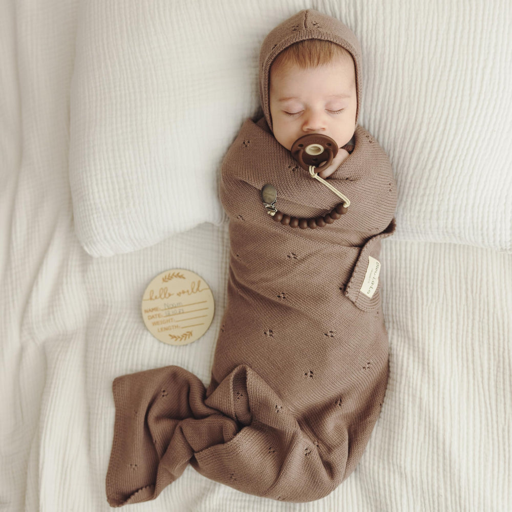 Bleu La La Pointelle Swaddle Mocha swaddling in action demonstrates stretch