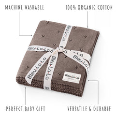 Bleu La La Pointelle Swaddle Mocha worn as snug wrap for newborns