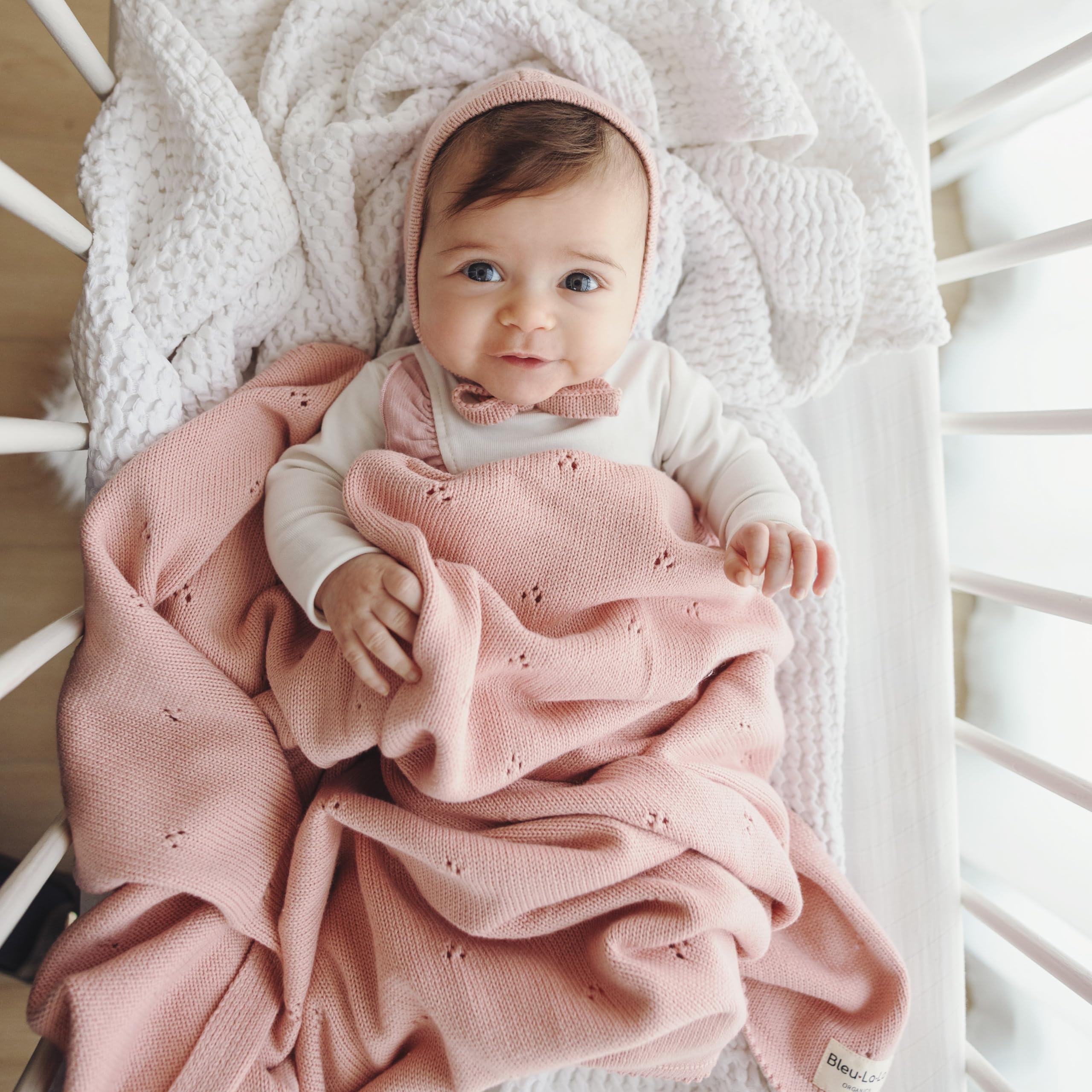 Bleu La La Pointelle Swaddle Nursery Theme; versatile blanket complements crib décor.
