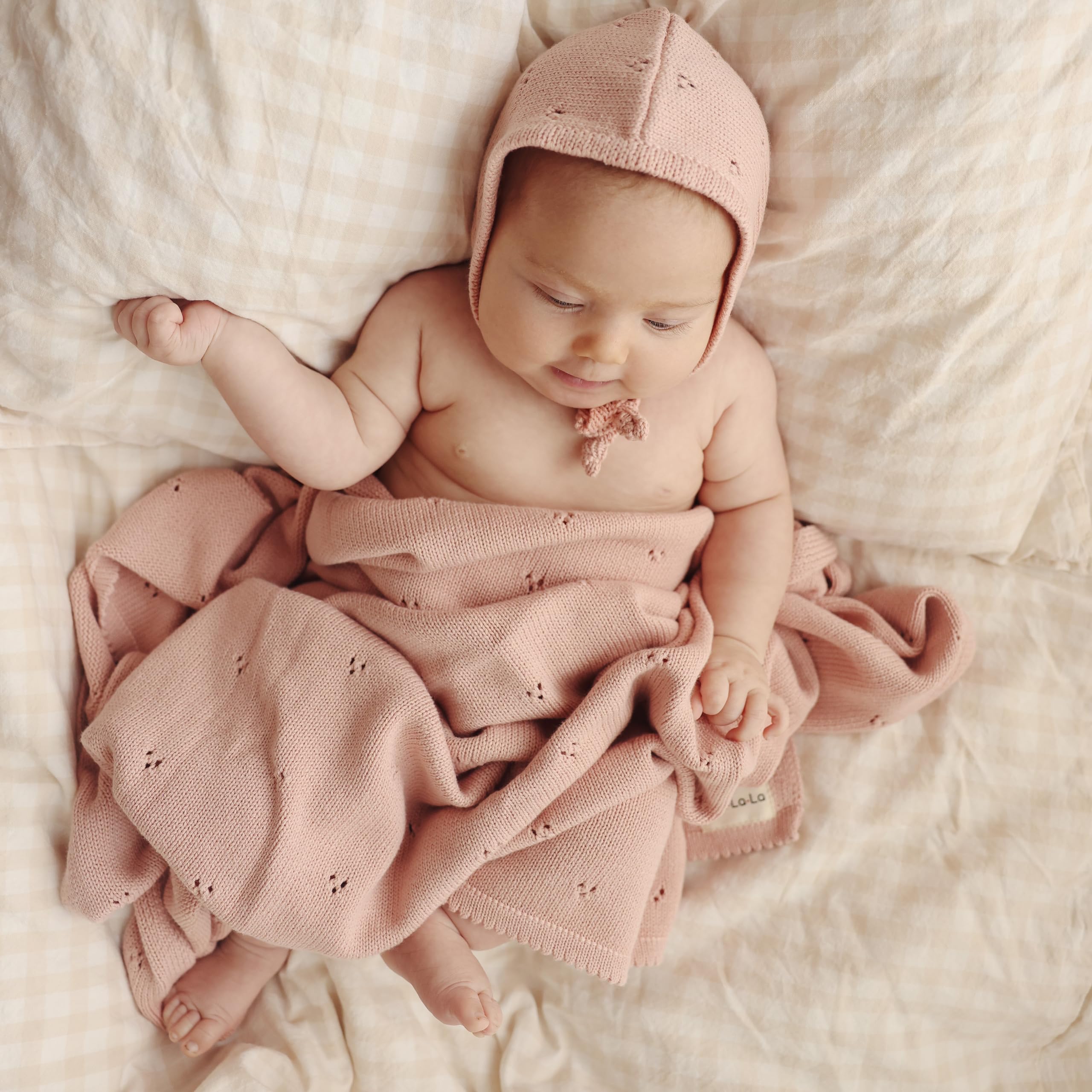 Bleu La La Pointelle Swaddle Child Wearing; easy wrap for stroller cuddles.