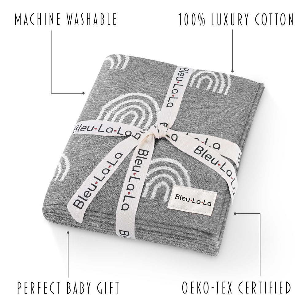 Bleu La La Rainbow Grey receiving blanket in crib demonstrates cozy, breathable comfort from 100% cotton.