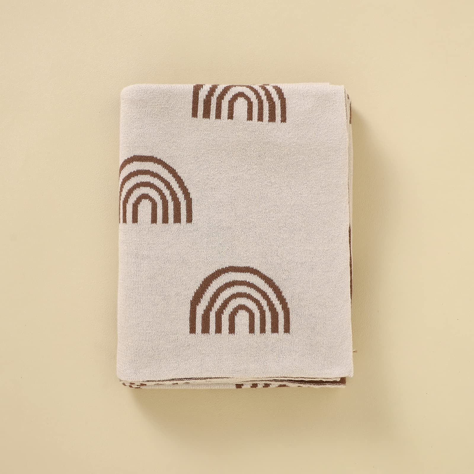Bleu La La rainbow-taupe blanket highlights charity initiative supporting fertility causes.