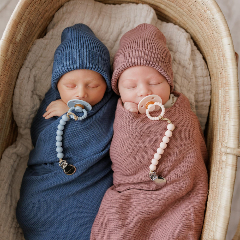 Bleu La La Sugar Plum baby hat on newborn demonstrates snug, gentle knit.