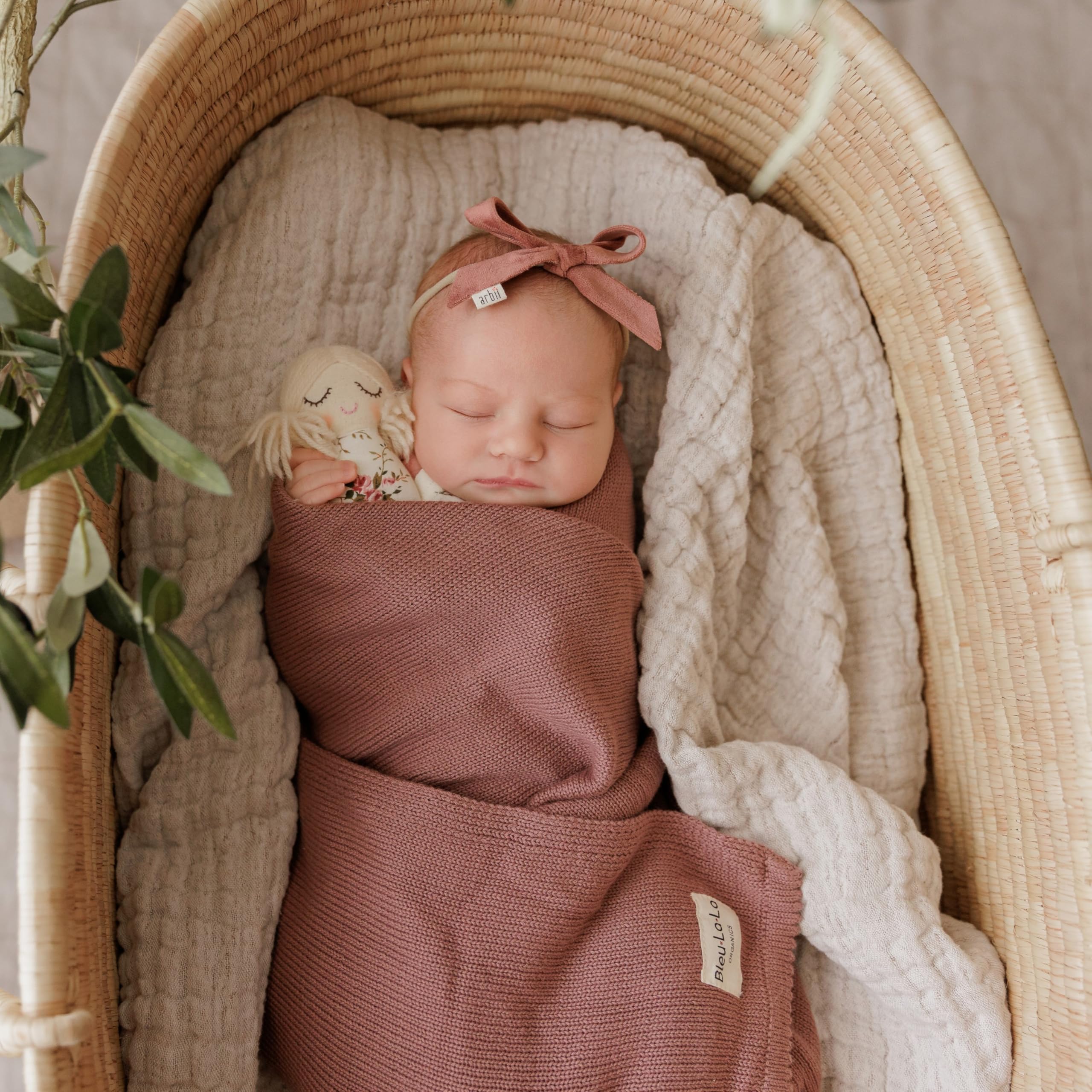 Bleu La La Sugar Plum blanket shown during cuddle time for nap comfort.