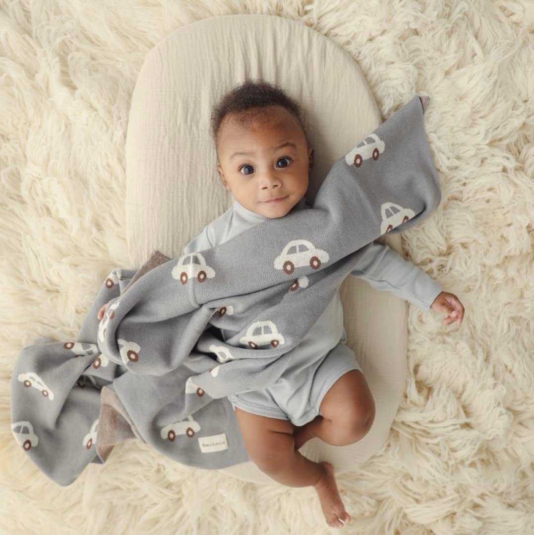 Bleu La La swaddle fabric texture closeup shows buttery-soft natural cotton.