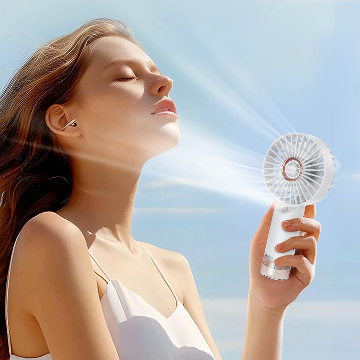 BlingTrail mini handheld fan with water mist closeup showing cooling mist for travel