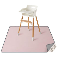 Blissful Diary baby splat mat under high chair in blush pink catches messes for easy cleanup.