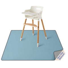 Blissful Diary Baby Splat Mat under high chair catching spills and crumbs.