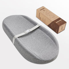 Blissful Diary changing pad on dresser top demonstrates portable nursery essential.