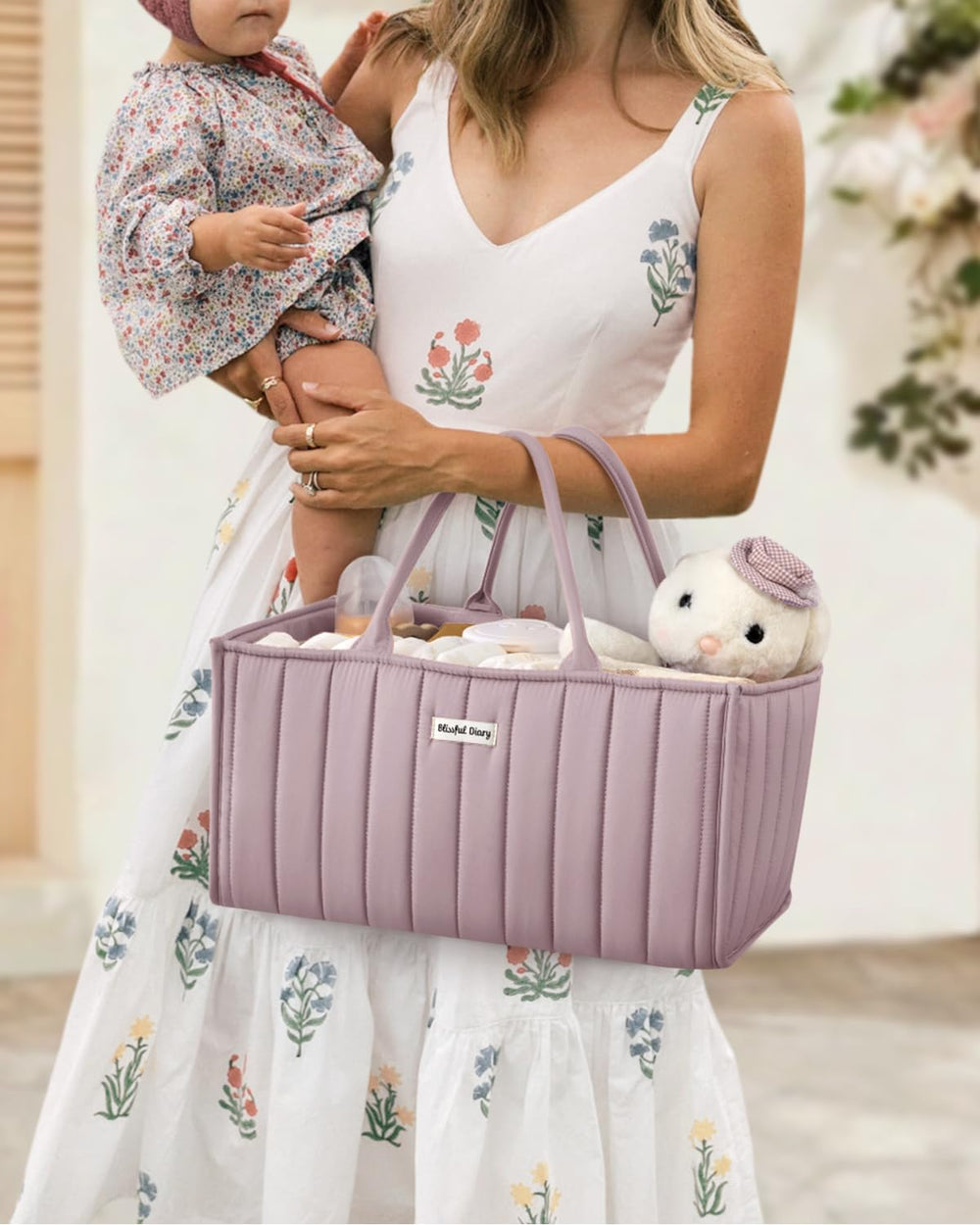 Blissful Diary diaper caddy's multiple compartments store breast pumps and parts neatly.