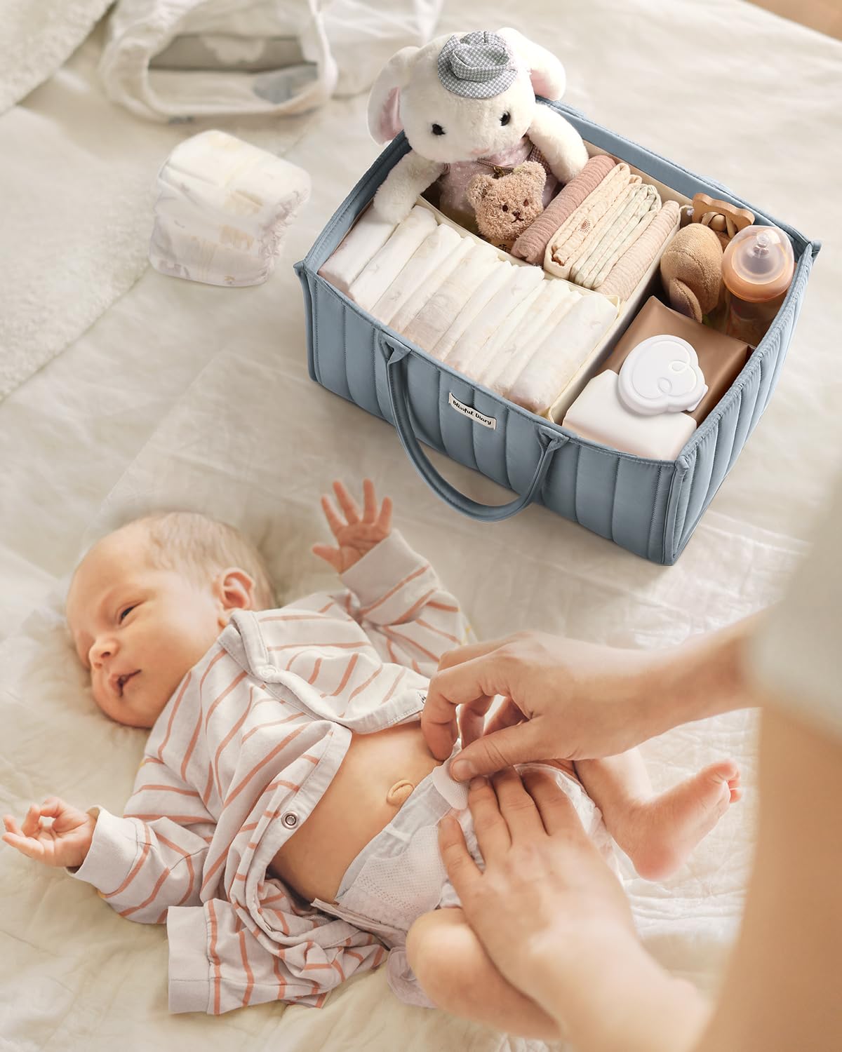 Blissful Diary diaper caddy used as car organizer for on-the-go baby essentials.