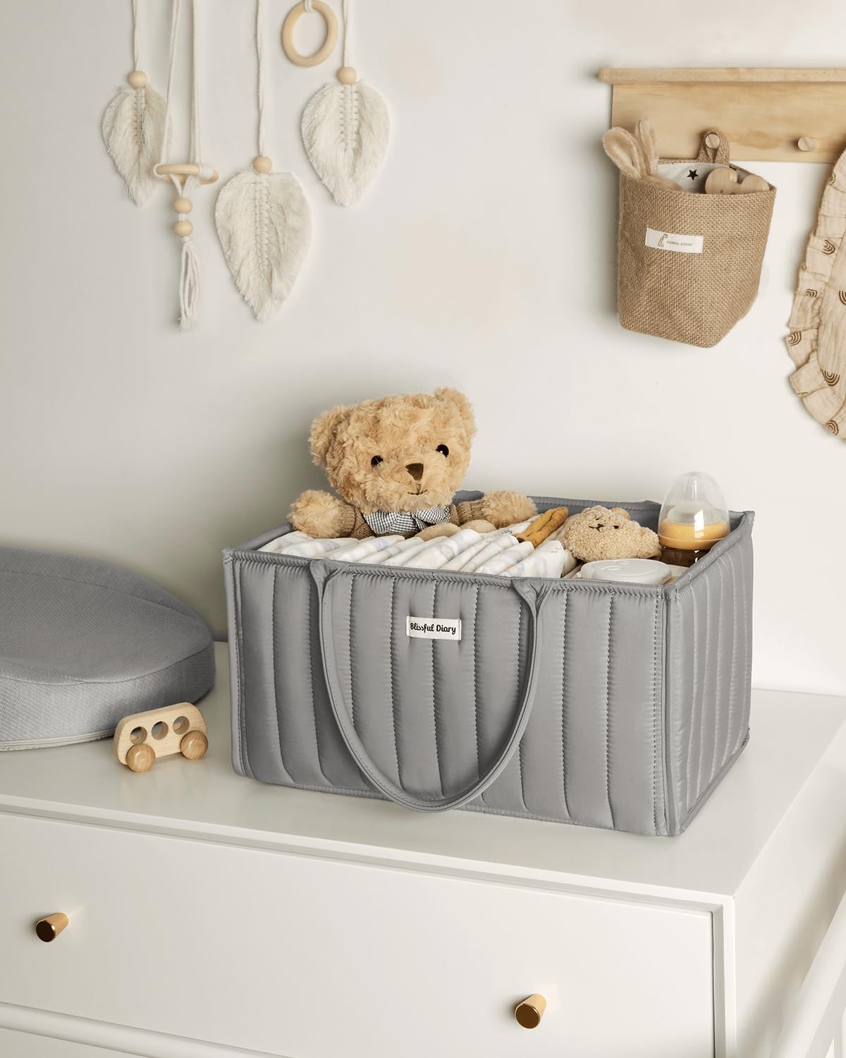 Blissful Diary diaper caddy keeping nappies and creams within reach during diaper changes.