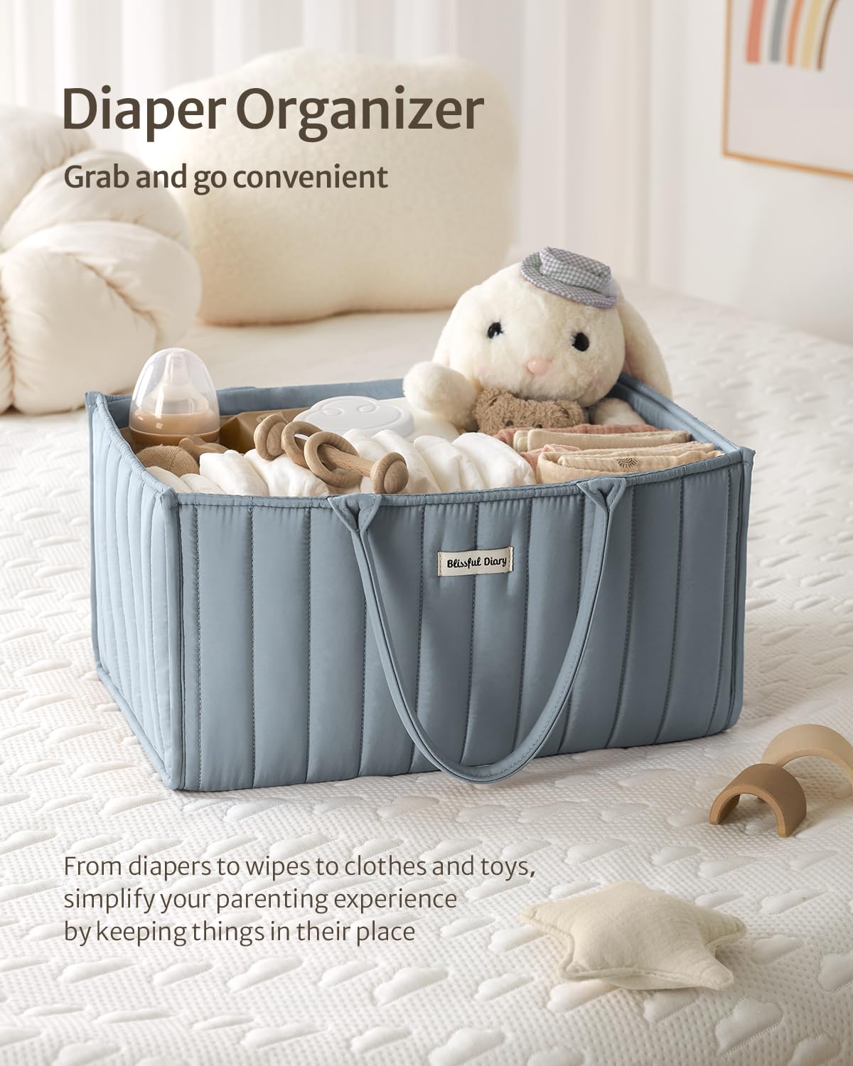 Blissful Diary diaper caddy with multiple compartments for diapers, wipes, bottles, and creams.