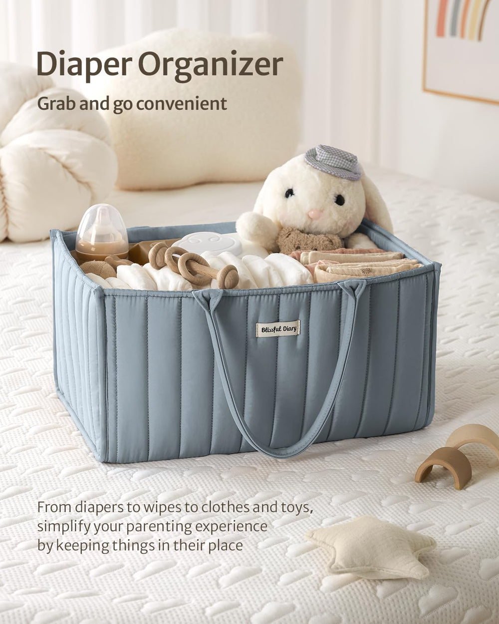 Blissful Diary diaper caddy with multiple compartments for diapers, wipes, bottles, and creams.