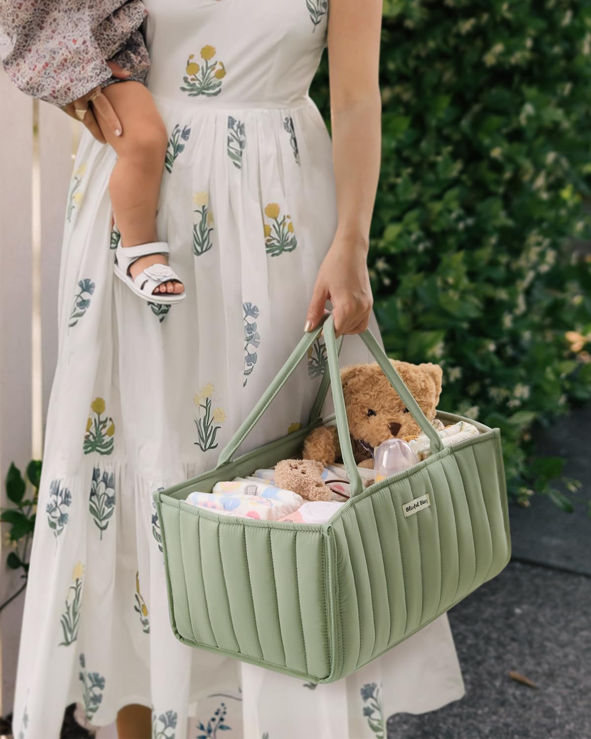 Blissful Diary Sage green caddy used as nursery storage for easy access during feeds and changes.