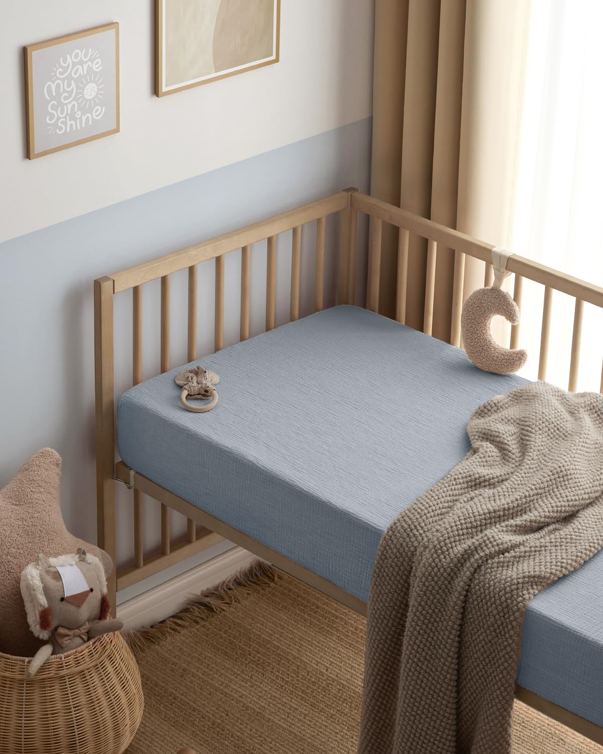 Blissful Diary dual-color sheets in blue and grey offer versatile nursery styling