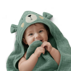 Blissful Diary muslin baby hooded towel with bear hood on a cozy newborn