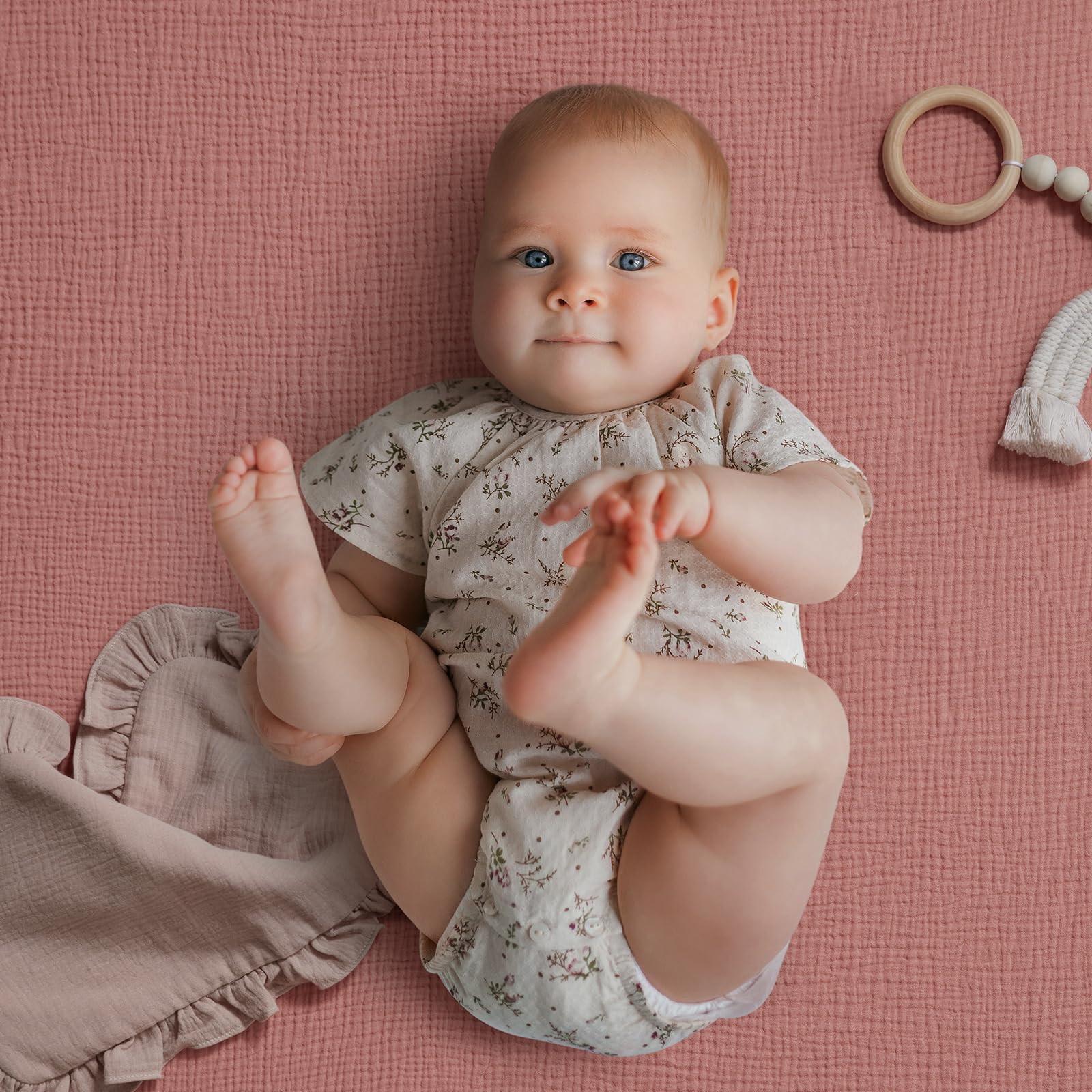 Blissful Diary muslin crib sheet elastic-fit close-up shows secure, snug mattress coverage.