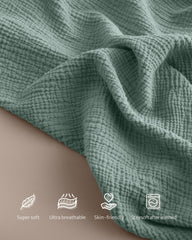 Blissful Diary nursing cover in Roman Green shows breathable muslin fabric for summer comfort.