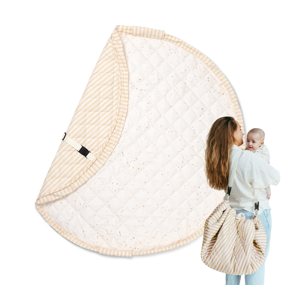 Blooom confetti 47in play mat flat lay shows plush quilting for cozy tummy time.
