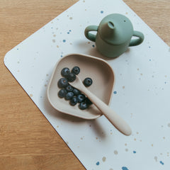 Blooom placemat confetti closeup material highlights stain-resistant vinyl and safe design