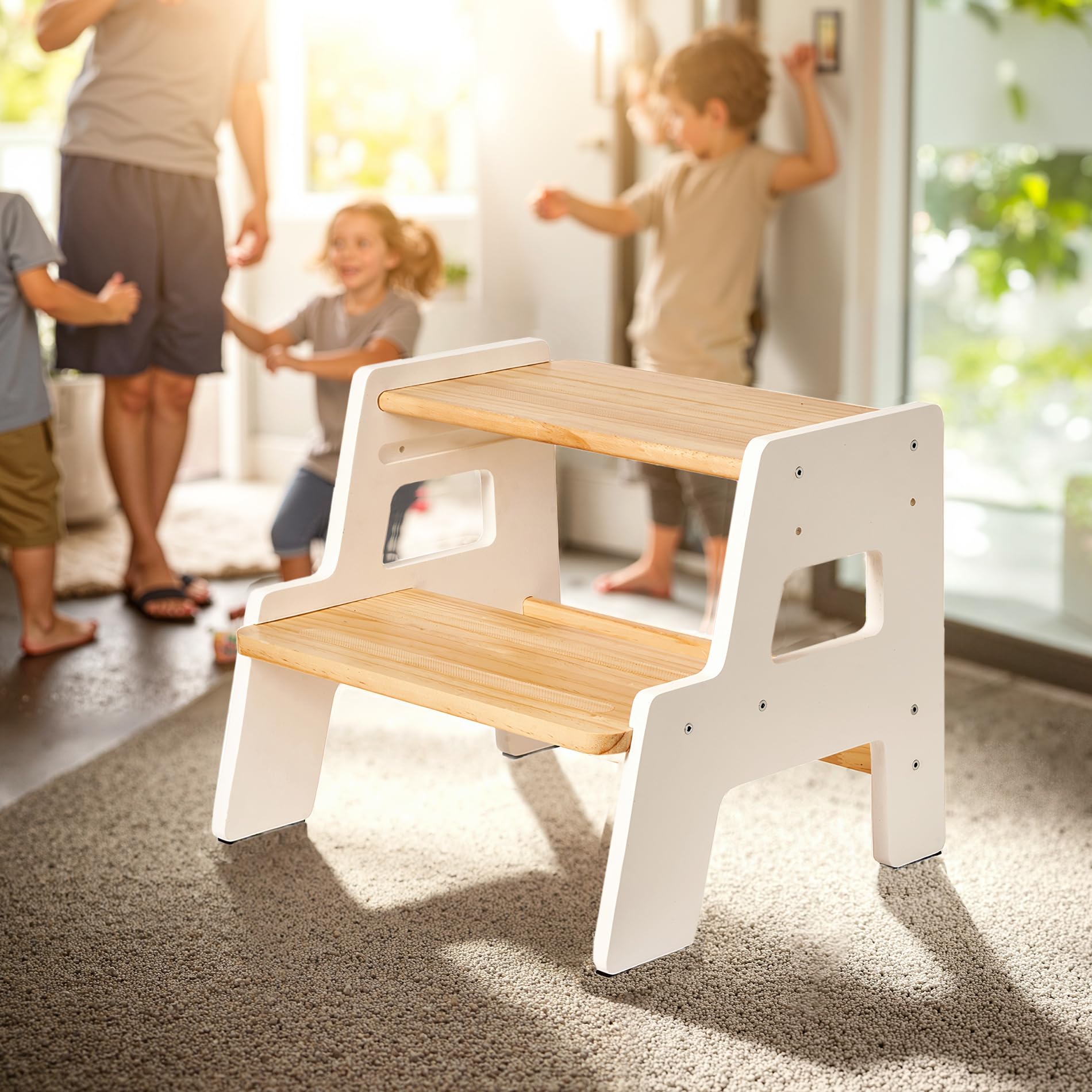 Blossome toddler stool in use at the sink for handwashing and grooming.