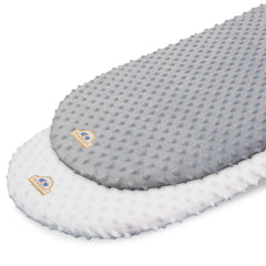 BlueSnail bassinet sheet folded in white and gray shows soft, cozy minky fabric.