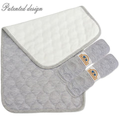 BlueSnail Changing Pad Liner in use with baby on gray changing pad, easy cleanup